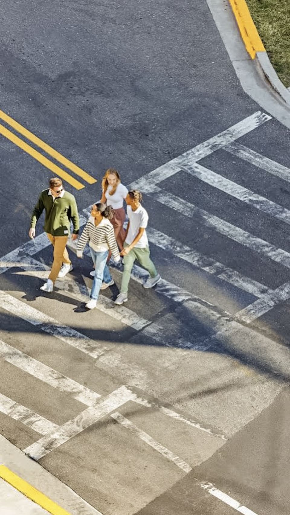 group of students walking across the street