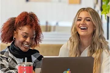 two young women studying