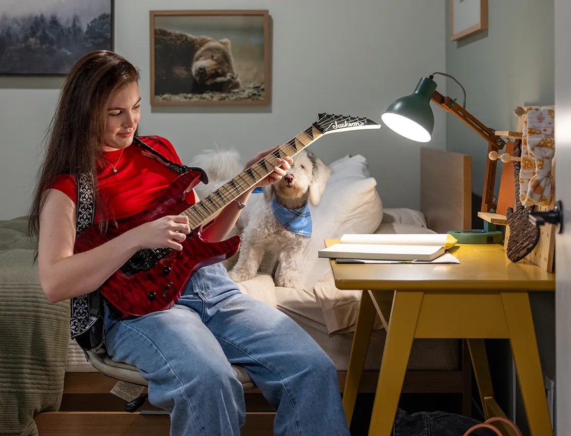 young woman play guitar