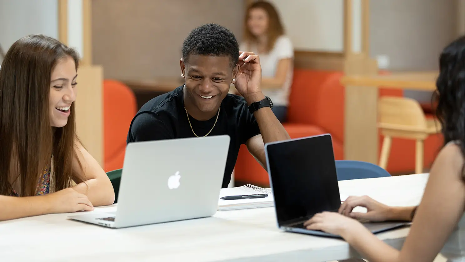 people using a laptop